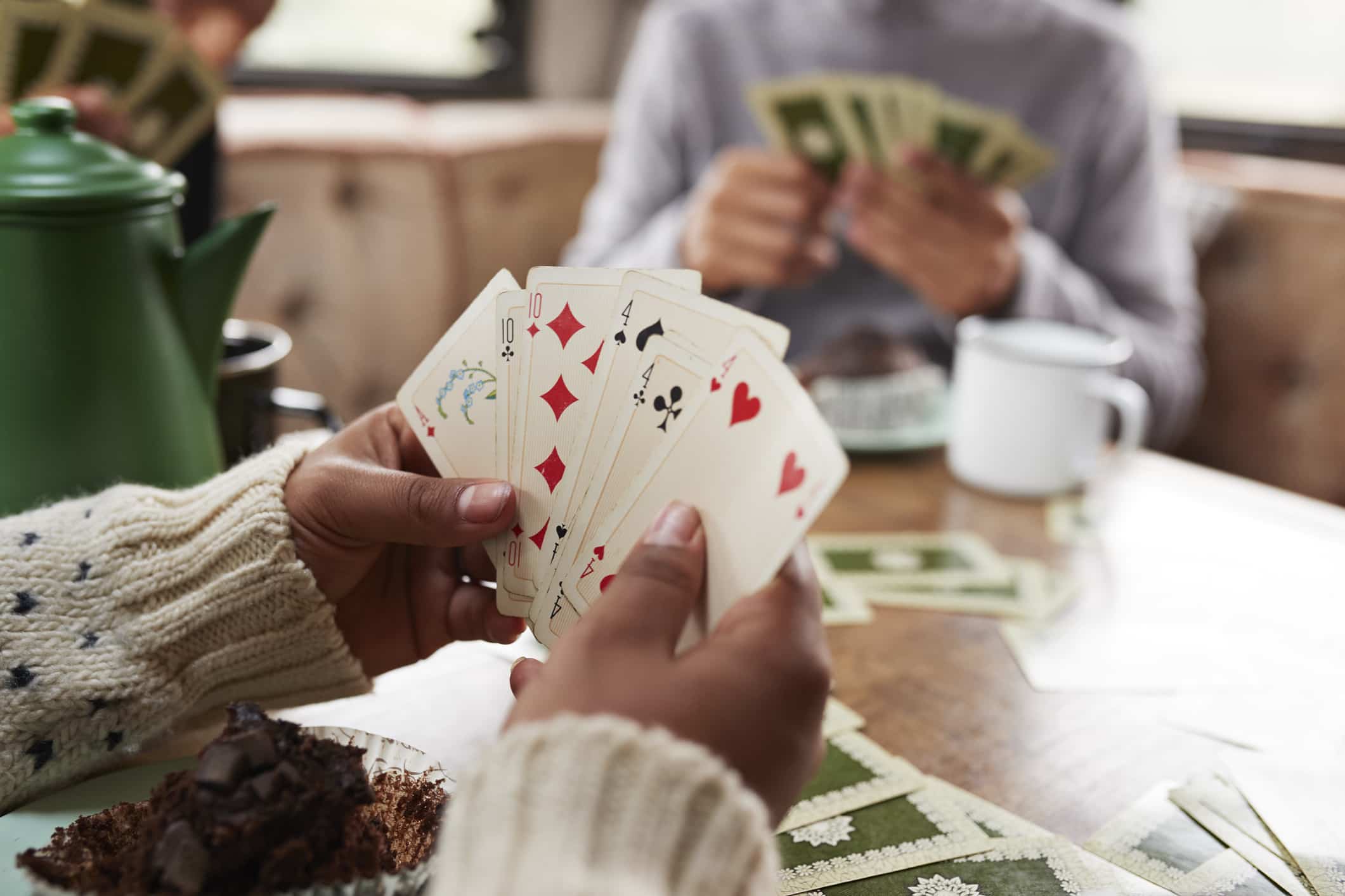 Friends playing cards in camper van