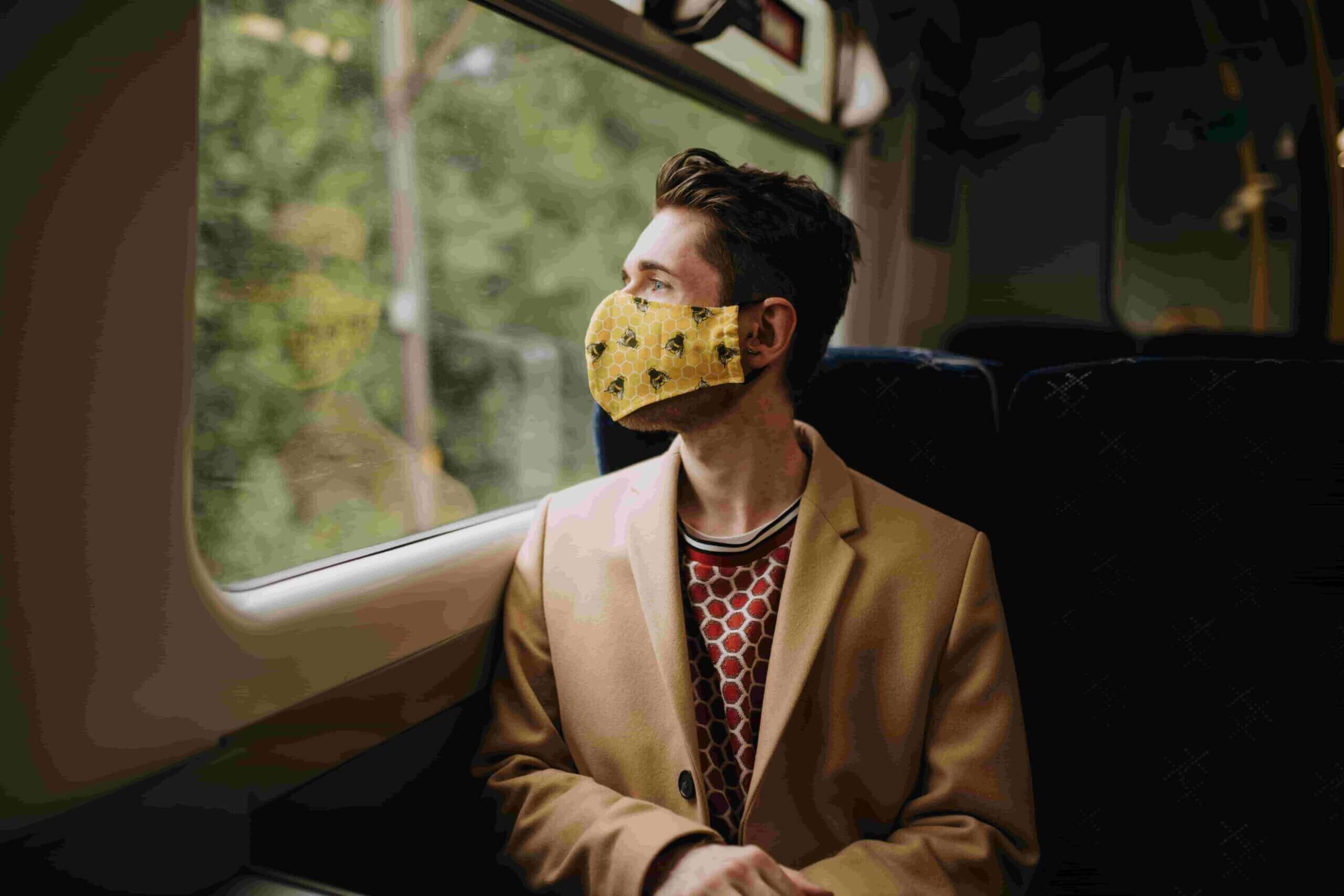 a man travelling with a face mask