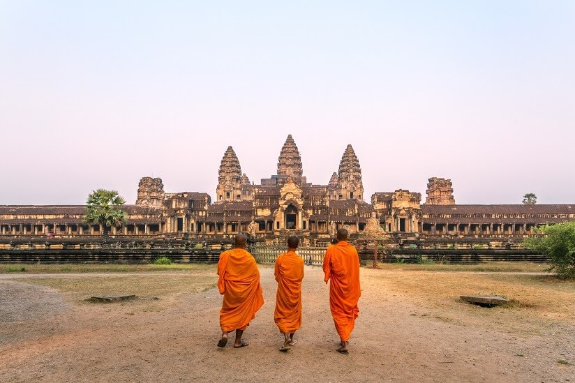 People Walking Near A Temple In Cambodia