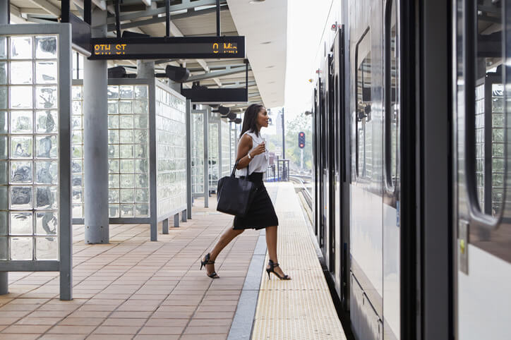 a woman walking into a train