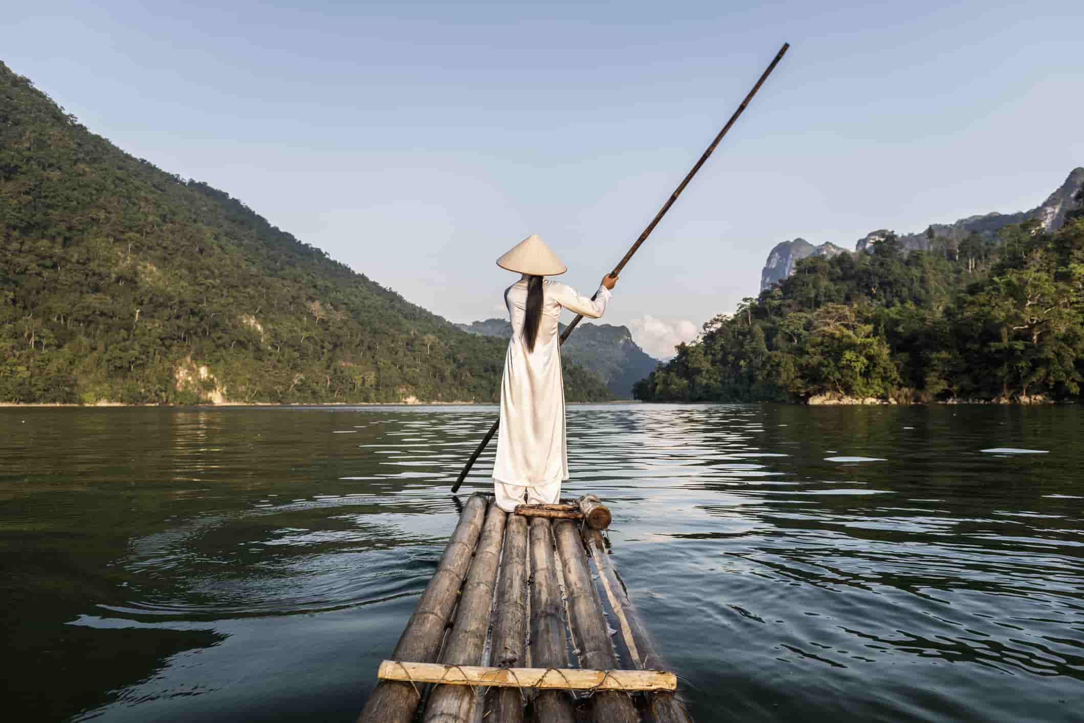 young woman sailing across a lake in Vietnam
