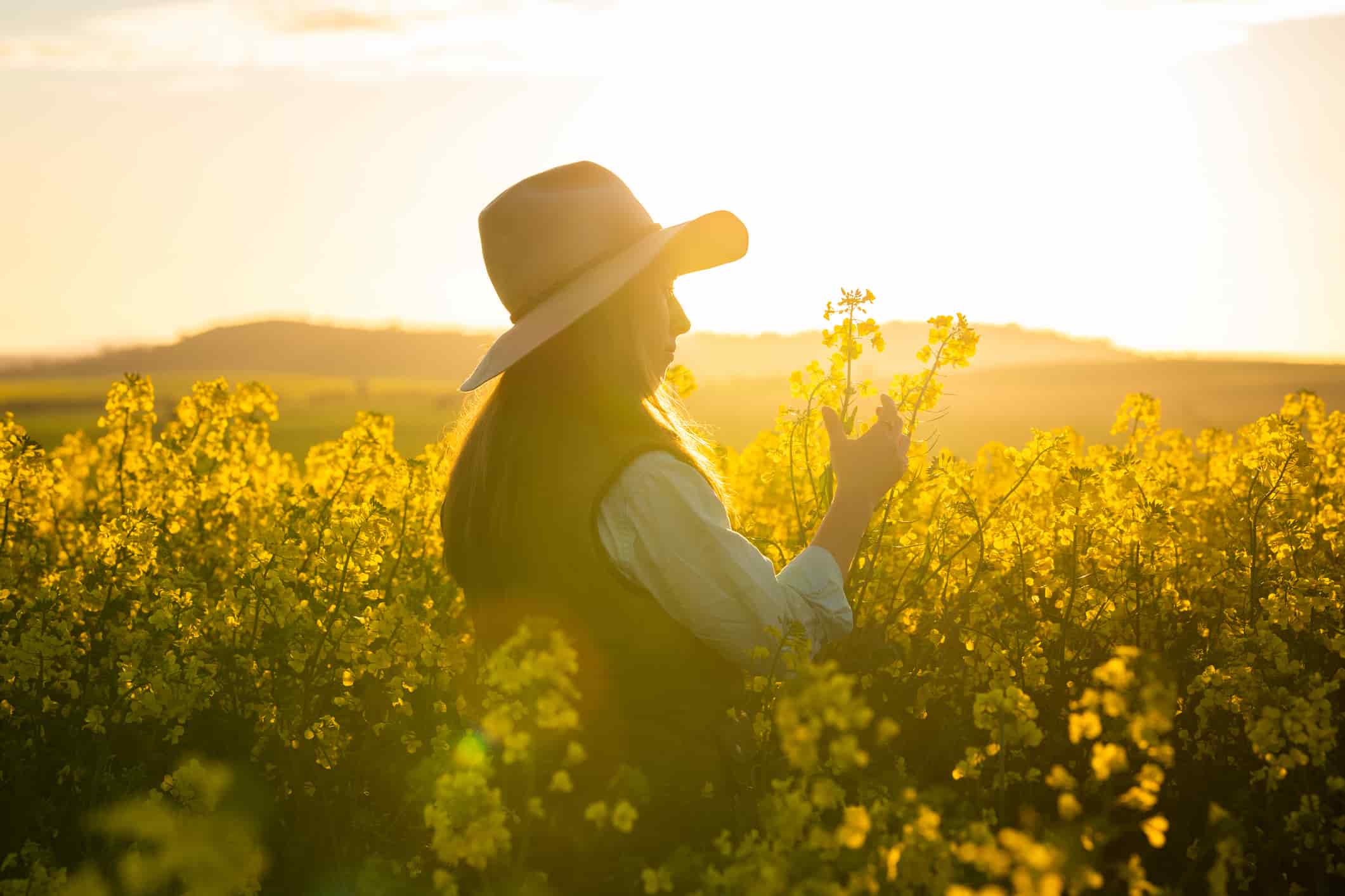 female farmer inspecting crops