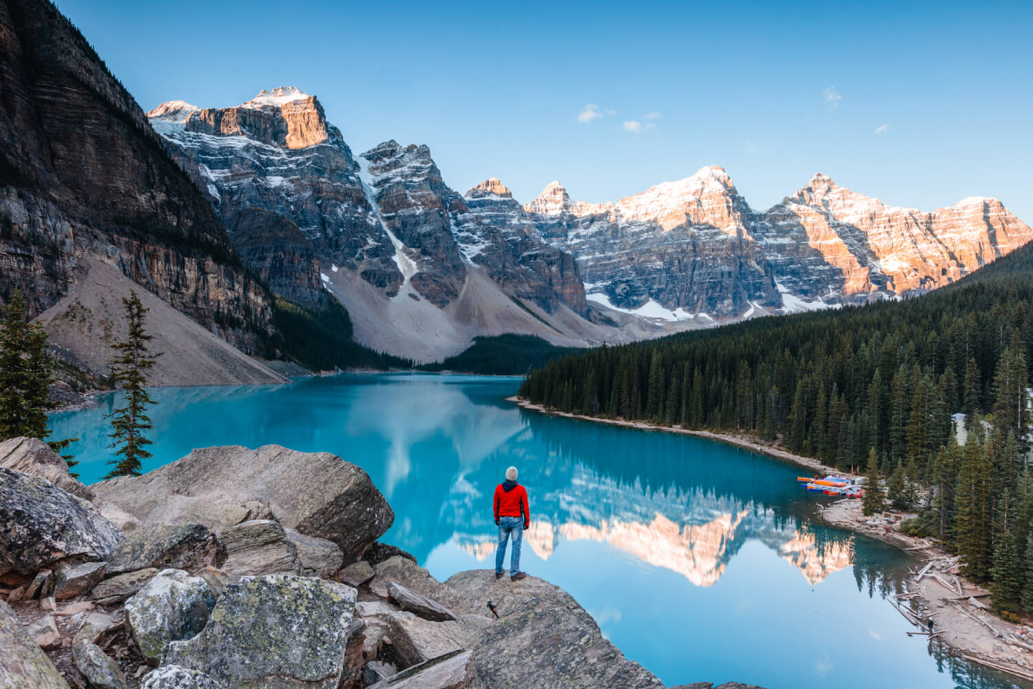 a man looking at the Moraine lake in Banff National Park, Alberta, Canada