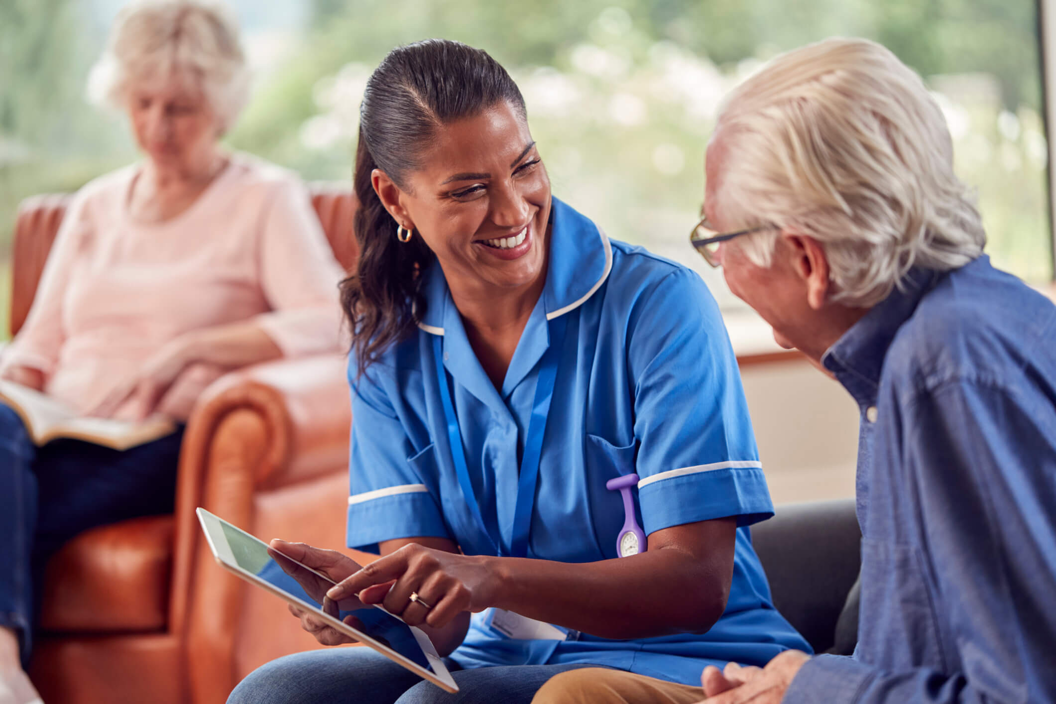 healthcare worker talking to another person