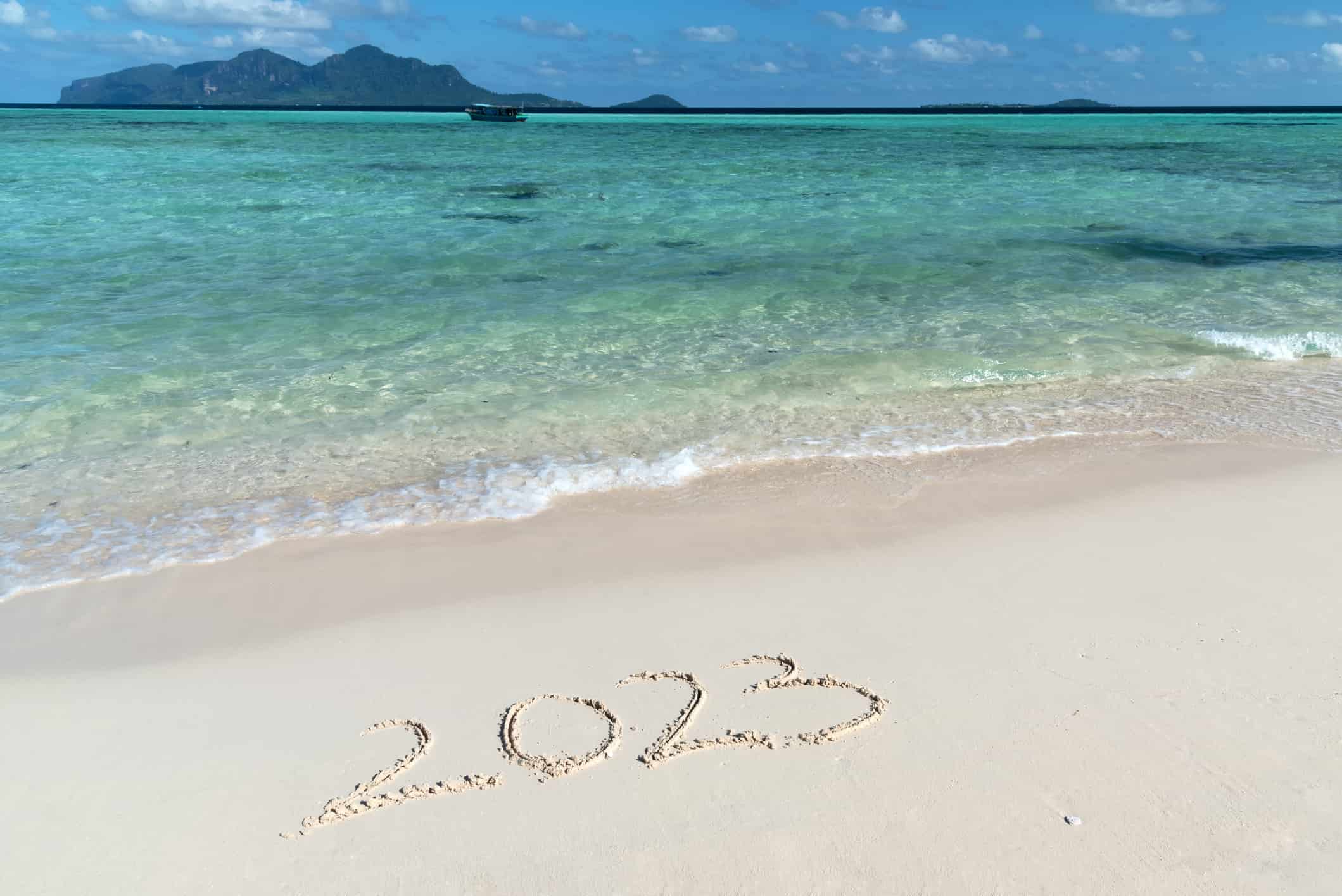 2023 written on a beach