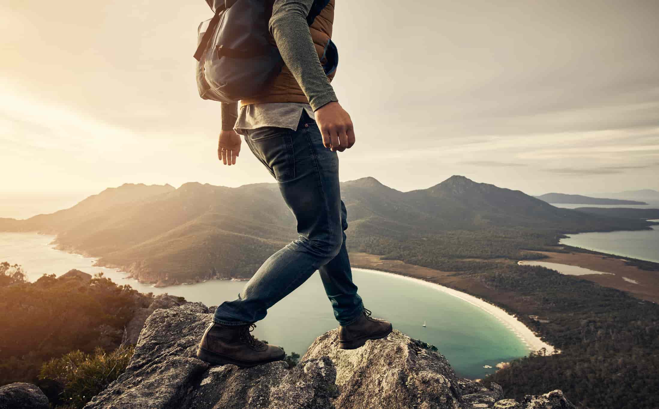 a man hiking through the mountains