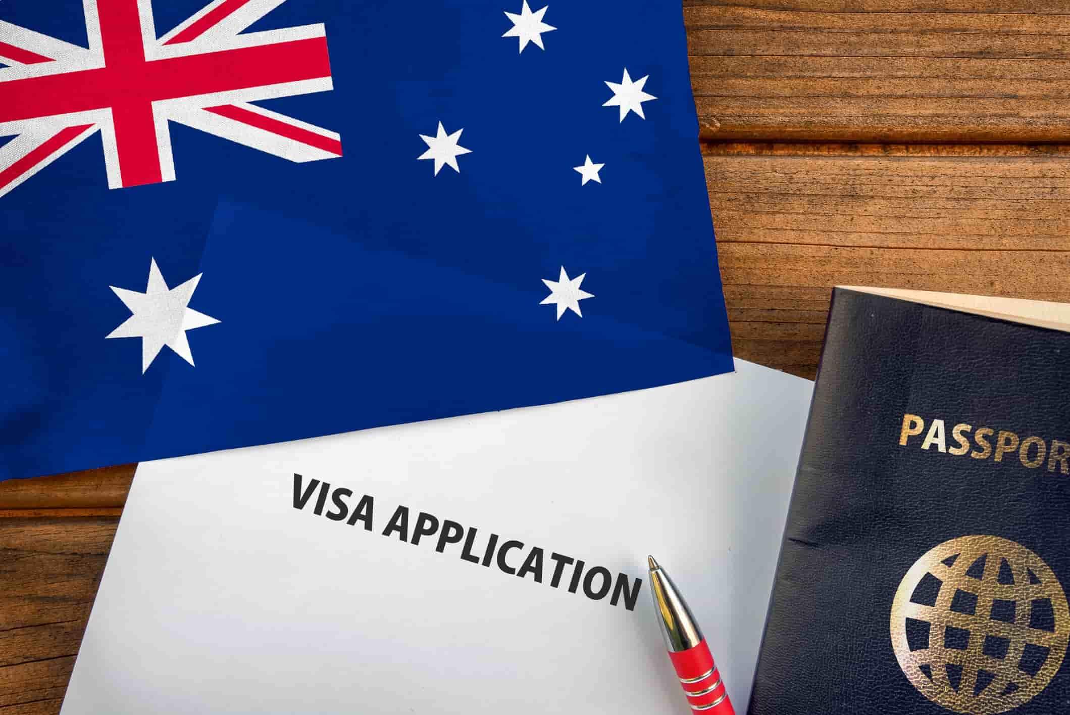 visa application form, a passport and flag of Australia