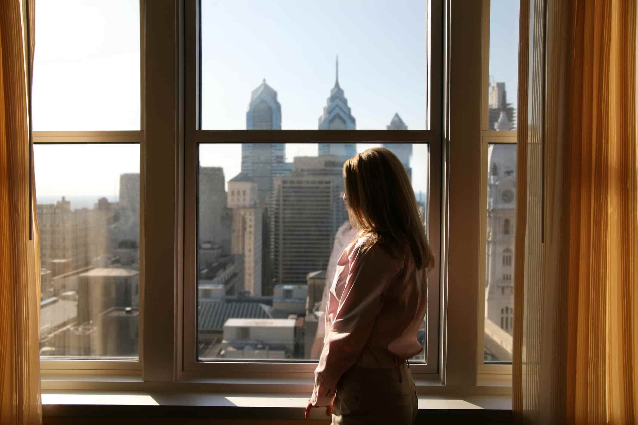 woman relaxing in her New York hotel room